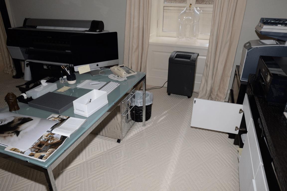 A home office with printers set up on a desk